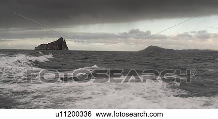 Pacific Ocean with Kicker Rock in the background, San Cristobal Island, Galapagos Islands, Ecuador View Large Photo Image Stock Photograph - Pacific Ocean with Kicker Rock in the background, San Cristobal Island, Galapagos Islands, Ecuador. Fotosearch