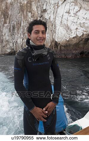 Portrait of a scuba diver, Kicker Rock, San Cristobal Island, Galapagos Islands, Ecuador View Large Photo Image Stock Photography - Portrait of a scuba diver, Kicker Rock, San Cristobal Island, Galapagos Islands, Ecuador. Fotosearch