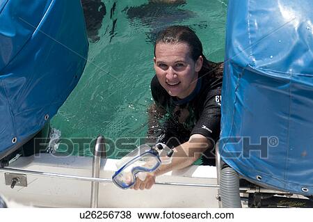 Stock Photo - Portrait of a scuba diver smiling, San Cristobal Island, Galapagos Islands, Ecuador. Fotosearch