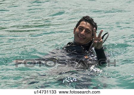 Scuba diver in the ocean, San Cristobal Island, Galapagos Islands, Ecuador View Large Photo Image Stock Image - Scuba diver in the ocean, San Cristobal Island, Galapagos Islands, Ecuador. Fotosearch