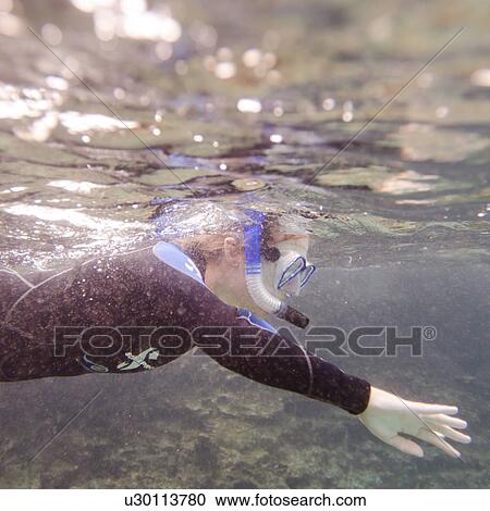 Scuba diver swimming underwater, Puerto Egas, Santiago Island, Galapagos Islands, Ecuador View Large Photo Image Stock Image - Scuba diver swimming underwater, Puerto Egas, Santiago Island, Galapagos Islands, Ecuador. Fotosearch