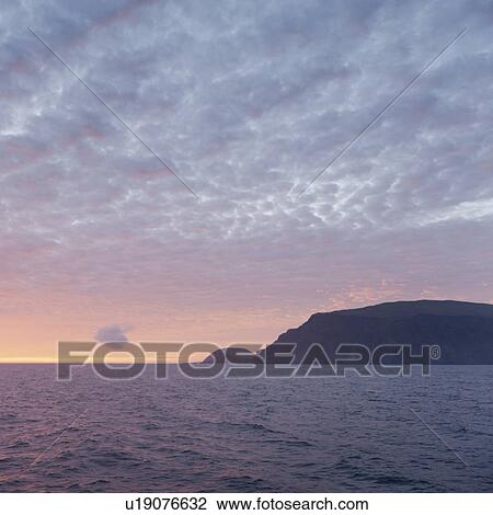 Stock Image - Silhouette of an island in the Pacific Ocean, Isabela Island, Galapagos Islands, Ecuador. Fotosearch