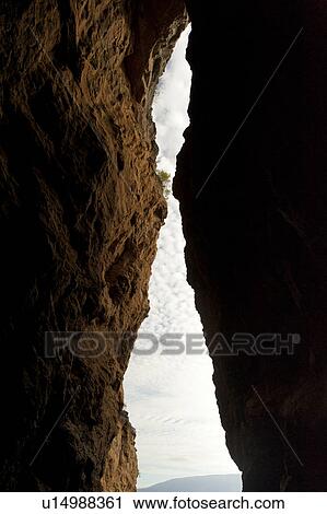 Sky viewed through the slot between two cliffs, Tagus Cove, Isabela Island, Galapagos Islands, Ecuador View Large Photo Image Stock Image - Sky viewed through the slot between two cliffs, Tagus Cove, Isabela Island, Galapagos Islands, Ecuador. Fotosearch