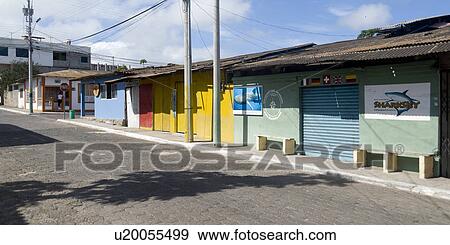 Stock Photo - Stores along a road, Puerto Baquerizo Moreno, San Cristobal Island, Galapagos Islands, Ecuador. Fotosearch