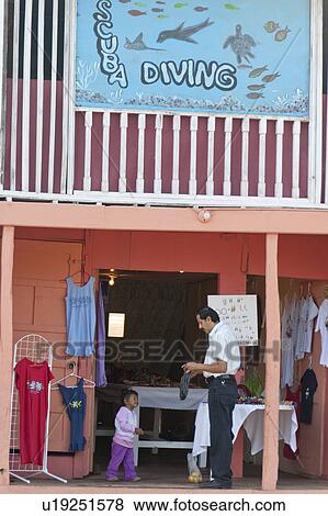 Tourist at a souvenir shop, Puerto Baquerizo Moreno, San Cristobal Island, Galapagos Islands, Ecuador View Large Photo Image Stock Photo - Tourist at a souvenir shop, Puerto Baquerizo Moreno, San Cristobal Island, Galapagos Islands, Ecuador. Fotosearch