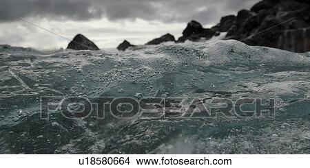 Waves breaking on the coast, Playa Ochoa, San Cristobal Island, Galapagos Islands, Ecuador View Large Photo Image Picture - Waves breaking on the coast, Playa Ochoa, San Cristobal Island, Galapagos Islands, Ecuador. Fotosearch