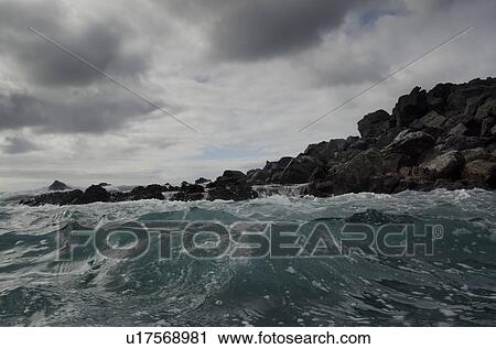 Waves breaking on the coast, Playa Ochoa, San Cristobal Island, Galapagos Islands, Ecuador View Large Photo Image Stock Image - Waves breaking on the coast, Playa Ochoa, San Cristobal Island, Galapagos Islands, Ecuador. Fotosearch