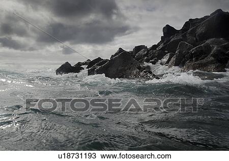 Waves breaking on the coast, Playa Ochoa, San Cristobal Island, Galapagos Islands, Ecuador View Large Photo Image Stock Image - Waves breaking on the coast, Playa Ochoa, San Cristobal Island, Galapagos Islands, Ecuador. Fotosearch
