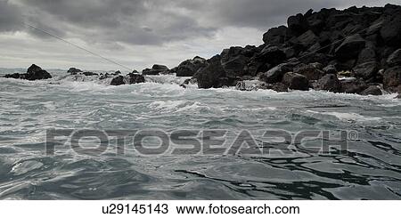 Waves breaking on the coast, Playa Ochoa, San Cristobal Island, Galapagos Islands, Ecuador View Large Photo Image Stock Image - Waves breaking on the coast, Playa Ochoa, San Cristobal Island, Galapagos Islands, Ecuador. Fotosearch