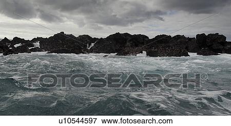 Waves breaking on the coast, Playa Ochoa, San Cristobal Island, Galapagos Islands, Ecuador View Large Photo Image Stock Photo - Waves breaking on the coast, Playa Ochoa, San Cristobal Island, Galapagos Islands, Ecuador. Fotosearch