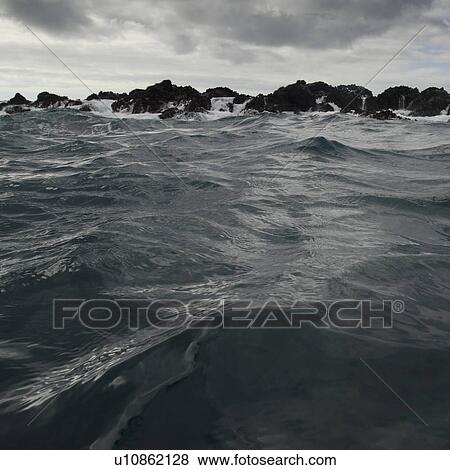 Waves breaking on the coast, Playa Ochoa, San Cristobal Island, Galapagos Islands, Ecuador View Large Photo Image Stock Photo - Waves breaking on the coast, Playa Ochoa, San Cristobal Island, Galapagos Islands, Ecuador. Fotosearch