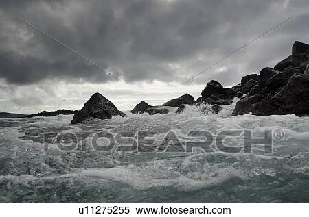 Stock Photography - Waves breaking on the coast, Playa Ochoa, San Cristobal Island, Galapagos Islands, Ecuador. Fotosearch