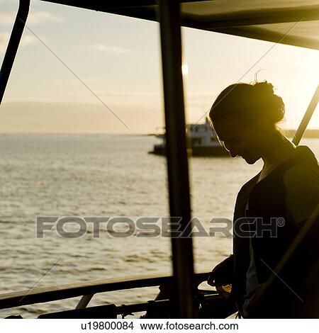 Woman smiling on boat, Punta Suarez, Espanola Island, Galapagos Islands, Ecuador View Large Photo Image Picture - Woman smiling on boat, Punta Suarez, Espanola Island, Galapagos Islands, Ecuador. Fotosearch