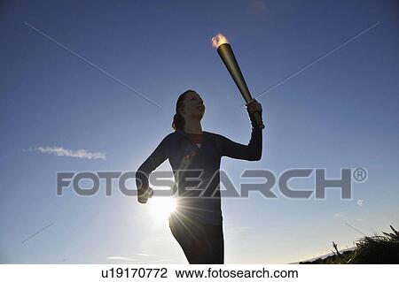 Athlete running with flaming baton View Large Photo Image Stock Image - Athlete running with flaming baton. Fotosearch