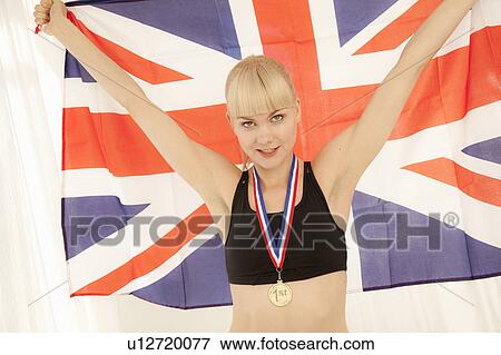 Athlete with medal and Union Jack flag View Large Photo Image Stock Photo - Athlete with medal and Union Jack flag. Fotosearch