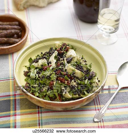 Stock Image - Bowl of lentil and artichoke salad. Fotosearch