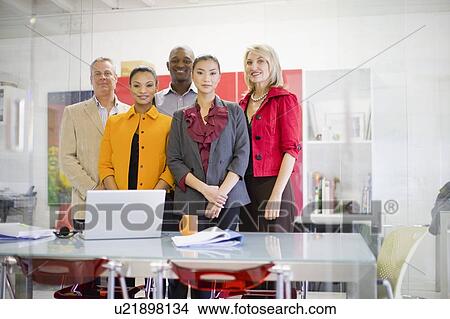 Picture - Business people smiling in office. Fotosearch