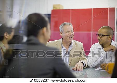 Stock Photo - Business people talking in conference. Fotosearch