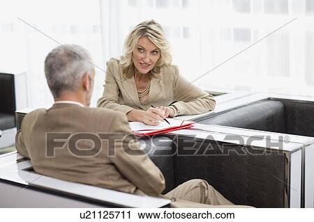 Business people talking in lobby area View Large Photo Image Stock Image - Business people talking in lobby area. Fotosearch