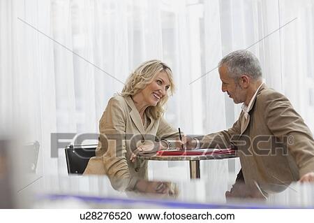 Business people talking in lobby area View Large Photo Image Stock Image - Business people talking in lobby area. Fotosearch