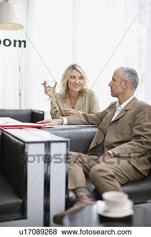 Business people talking in lobby area View Large Photo Image Stock Photo - Business people talking in lobby area. Fotosearch