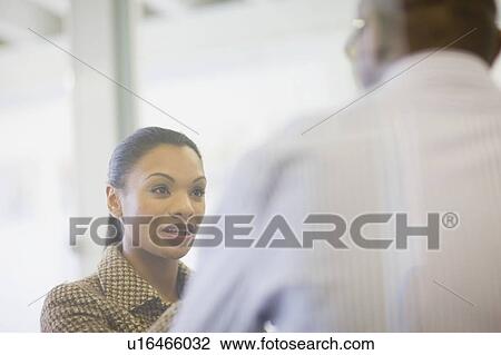Business people talking in office View Large Photo Image Stock Image - Business people talking in office. Fotosearch