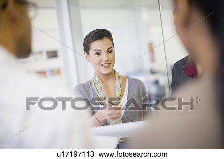 Business people talking in office View Large Photo Image Stock Image - Business people talking in office. Fotosearch