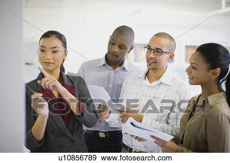 Business people talking in office View Large Photo Image Stock Photo - Business people talking in office. Fotosearch
