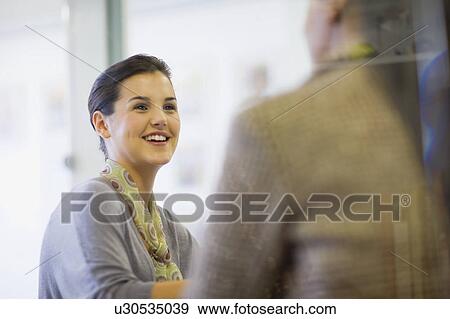 Business people talking in office View Large Photo Image Stock Photo - Business people talking in office. Fotosearch