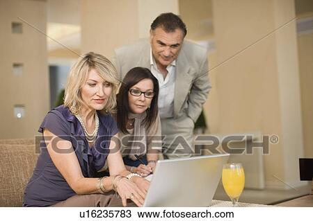 Business people working in lounge View Large Photo Image Stock Image - Business people working in lounge. Fotosearch