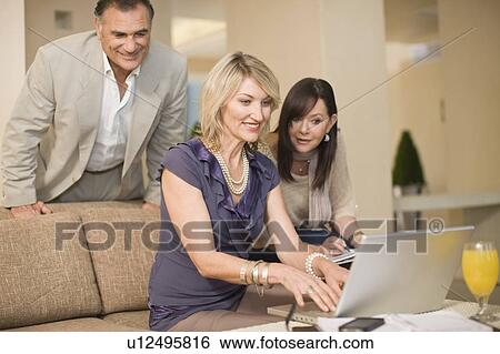 Business people working in lounge View Large Photo Image Stock Photograph - Business people working in lounge. Fotosearch