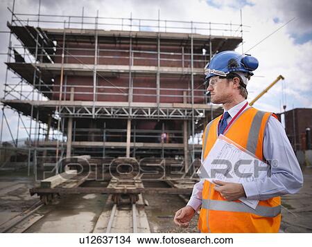 Businessman on shipbuilding site View Large Photo Image Picture - Businessman on shipbuilding site. Fotosearch