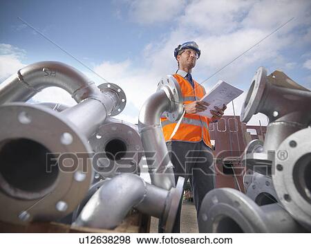 Businessman on shipbuilding site View Large Photo Image Stock Photo - Businessman on shipbuilding site. Fotosearch