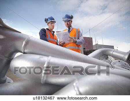 Stock Photo - Businessman on shipbuilding site. Fotosearch