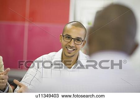 Businessman talking in conference View Large Photo Image Stock Image - Businessman talking in conference. Fotosearch