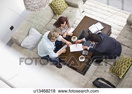 Businessman talking with couple View Large Photo Image Stock Photo - Businessman talking with couple. Fotosearch