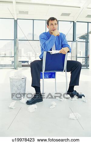 Businessman thinking in office View Large Photo Image Stock Image - Businessman thinking in office. Fotosearch