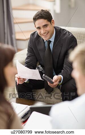Businessman working with couple View Large Photo Image Stock Photo - Businessman working with couple. Fotosearch