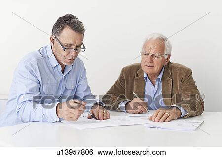 Businessmen talking in meeting View Large Photo Image Stock Photograph - Businessmen talking in meeting. Fotosearch