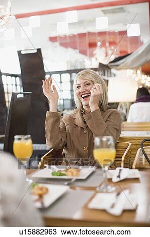 Businesswoman laughing at lunch View Large Photo Image Stock Image - Businesswoman laughing at lunch. Fotosearch