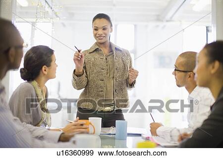 Businesswoman talking in conference View Large Photo Image Stock Photo - Businesswoman talking in conference. Fotosearch