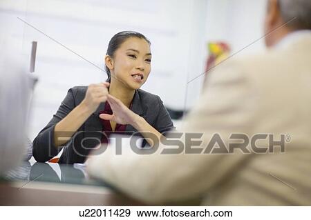Businesswoman talking in conference View Large Photo Image Stock Photo - Businesswoman talking in conference. Fotosearch