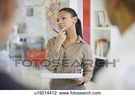 Businesswoman thinking in office View Large Photo Image Stock Image - Businesswoman thinking in office. Fotosearch