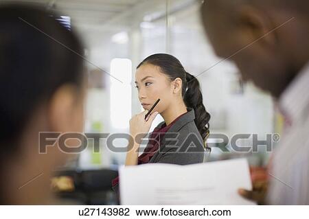 Businesswoman thinking in office View Large Photo Image Stock Image - Businesswoman thinking in office. Fotosearch