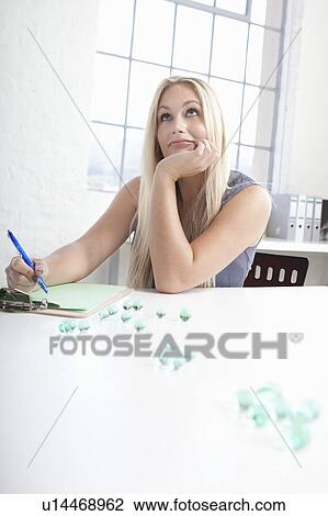 Businesswoman working with glass beads View Large Photo Image Stock Image - Businesswoman working with glass beads. Fotosearch