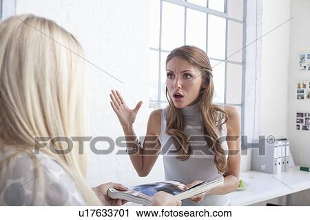 Businesswomen arguing in office View Large Photo Image Stock Image - Businesswomen arguing in office. Fotosearch