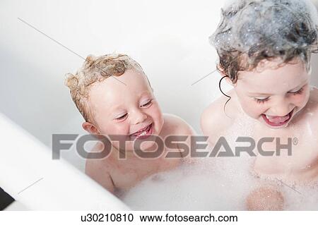 Children playing together in bubble bath View Large Photo Image Stock Image - Children playing together in bubble bath. Fotosearch