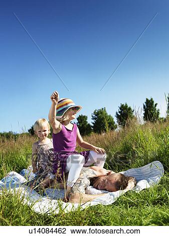 Children playing with father outdoors View Large Photo Image Stock Image - Children playing with father outdoors. Fotosearch