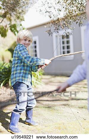 Children playing with sticks outdoors View Large Photo Image Stock Image - Children playing with sticks outdoors. Fotosearch