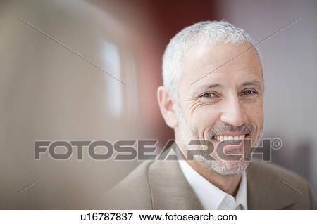Close up of businessman’s smiling face View Large Photo Image Stock Photo - Close up of businessman’s smiling face. Fotosearch